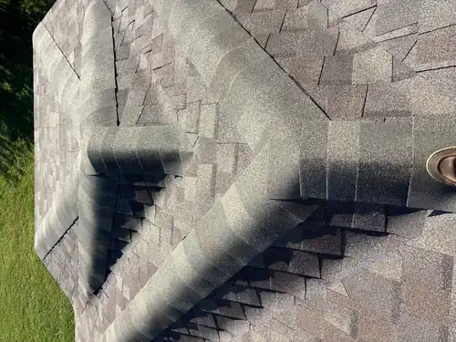 Close detail of a hip and ridge cap on a new shingle roof in Bentonville
