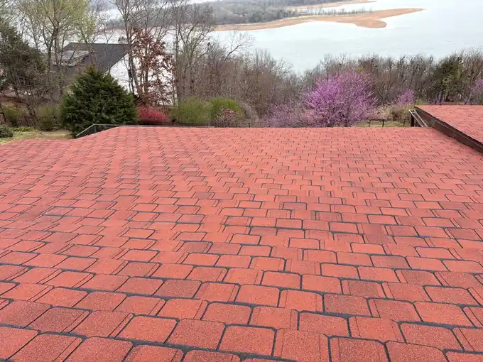 CertainTeed Grand Manor roof in Chestnut on a Rogers home above the lake