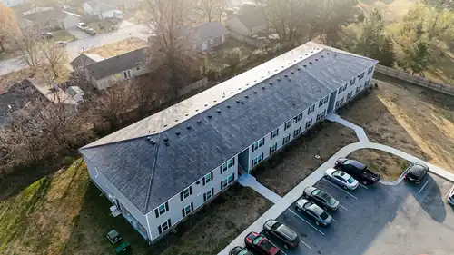 Drone front elevation of a two-storey apartment block with a full new roof